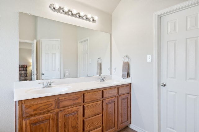 bathroom with double vanity and a sink