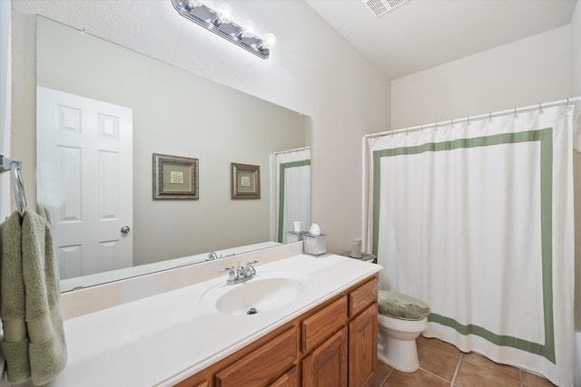 bathroom featuring toilet, tile patterned flooring, visible vents, and vanity