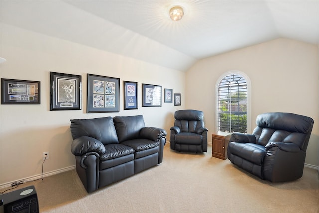 living area featuring baseboards, light carpet, and vaulted ceiling