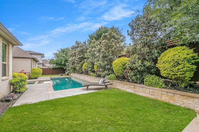 view of swimming pool with a lawn, a fenced backyard, a patio area, and a fenced in pool