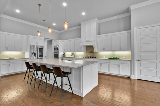 carpeted empty room with crown molding, a ceiling fan, baseboards, and a raised ceiling