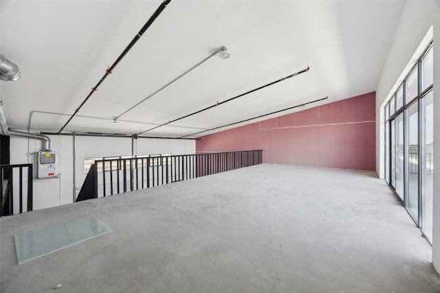 bonus room featuring unfinished concrete flooring