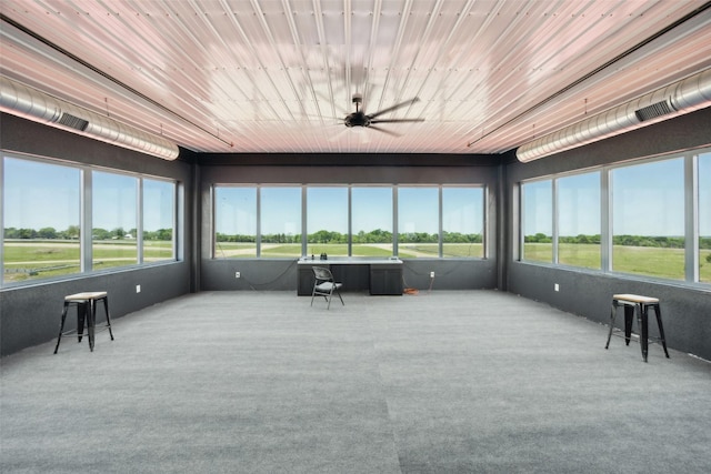 sunroom / solarium with ceiling fan, visible vents, and carpet floors