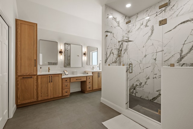 bathroom featuring recessed lighting, a marble finish shower, double vanity, and tile patterned floors