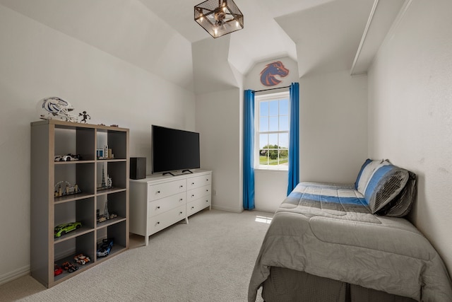 bedroom with light colored carpet and baseboards