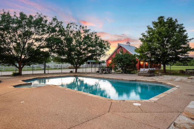 view of swimming pool with fence, a fenced in pool, and a patio area