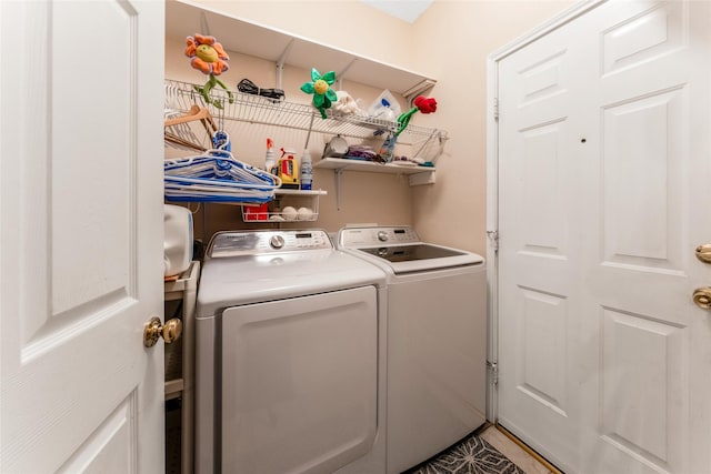 laundry room with independent washer and dryer and laundry area