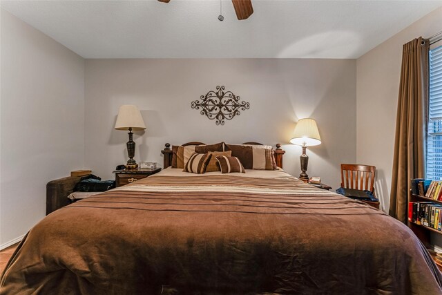 bedroom featuring wood finished floors and ceiling fan