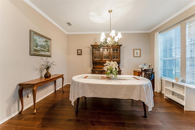 dining space with crown molding, an inviting chandelier, visible vents, and dark wood-type flooring