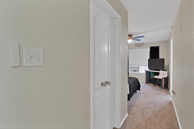 5652 Giddyup Ln, Fort Worth, TX 76179 - hallway featuring baseboards, carpet floors, and a textured wall