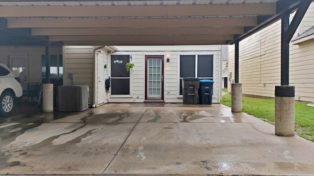 5652 Giddyup Ln, Fort Worth, TX 76179 - view of patio / terrace featuring an attached carport and central air condition unit