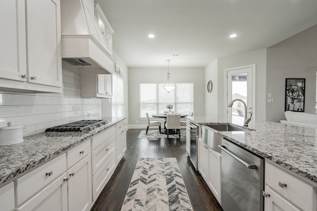 505 Eloise Dr, Heath, TX 75032 - kitchen with white cabinetry, stainless steel appliances, custom exhaust hood, and a healthy amount of sunlight