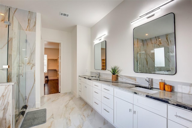 6702 Tyree St, Dallas, TX 75209 - full bathroom featuring marble finish flooring, a marble finish shower, double vanity, and baseboards
