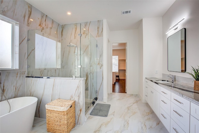 6702 Tyree St, Dallas, TX 75209 - full bathroom featuring a marble finish shower, marble tiled floors, vanity, and a freestanding tub