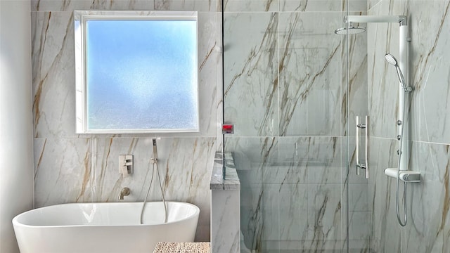 6702 Tyree St, Dallas, TX 75209 - full bath featuring healthy amount of natural light, a freestanding bath, a marble finish shower, and tile walls