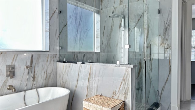 6702 Tyree St, Dallas, TX 75209 - bathroom featuring plenty of natural light, a marble finish shower, and a freestanding tub