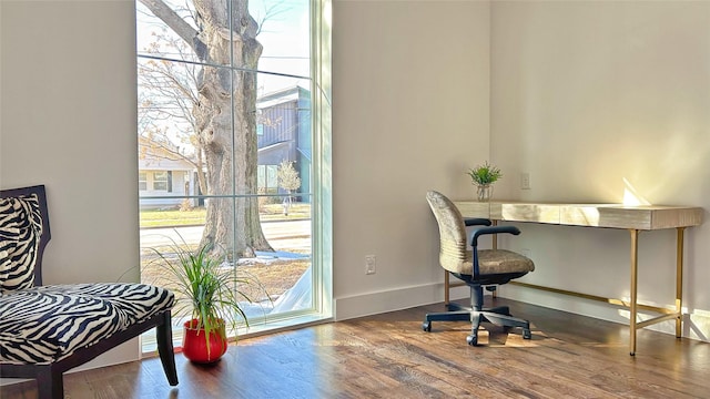 6702 Tyree St, Dallas, TX 75209 - home office with plenty of natural light, wood finished floors, and baseboards