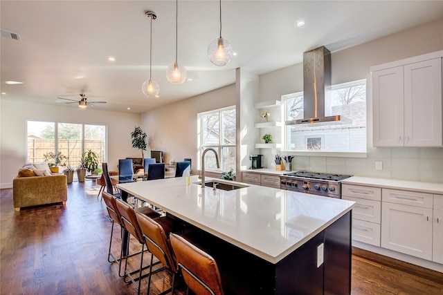6702 Tyree St, Dallas, TX 75209 - kitchen with island range hood, a sink, ceiling fan, open floor plan, and a kitchen island with sink