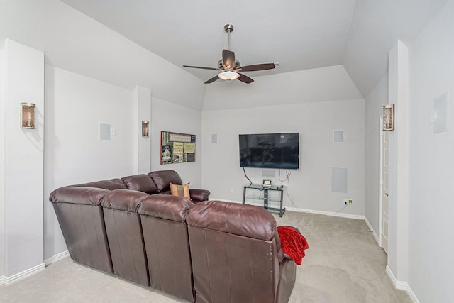 living room featuring baseboards, ceiling fan, light colored carpet, and lofted ceiling