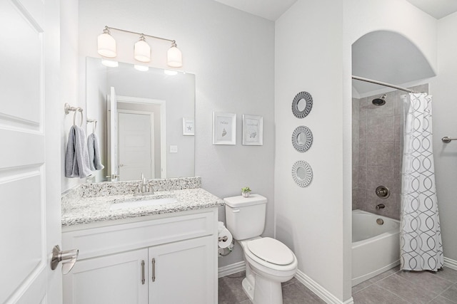 bathroom featuring shower / bath combination with curtain, tile patterned floors, baseboards, vanity, and toilet