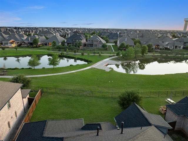 aerial view featuring a water view and a residential view