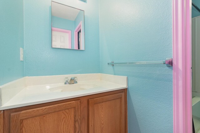 525 Butch Cassidy Dr, Anna, TX 75409 - bathroom featuring vanity and a textured wall