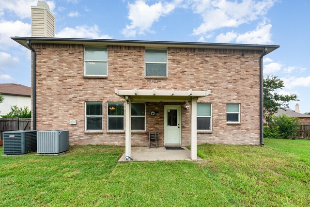 525 Butch Cassidy Dr, Anna, TX 75409 - back of property with central air condition unit, a chimney, a patio area, and brick siding