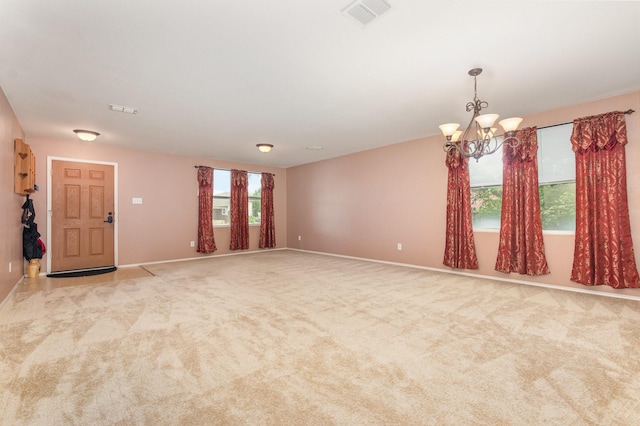 525 Butch Cassidy Dr, Anna, TX 75409 - spare room with a chandelier, baseboards, and carpet floors