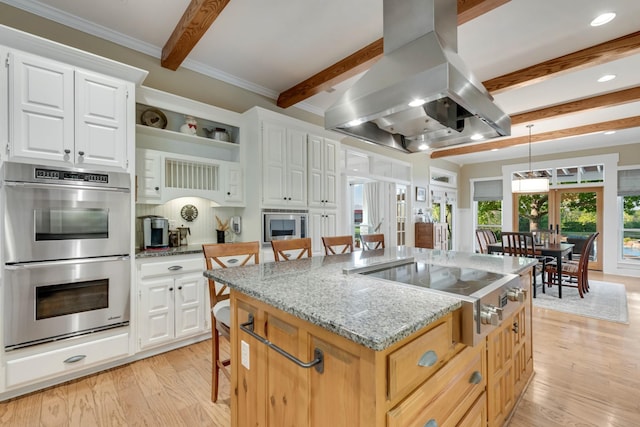 334 Pleasant Acres Rd, Rockwall, TX 75087 - kitchen featuring beam ceiling, light wood-type flooring, light stone counters, island range hood, and appliances with stainless steel finishes