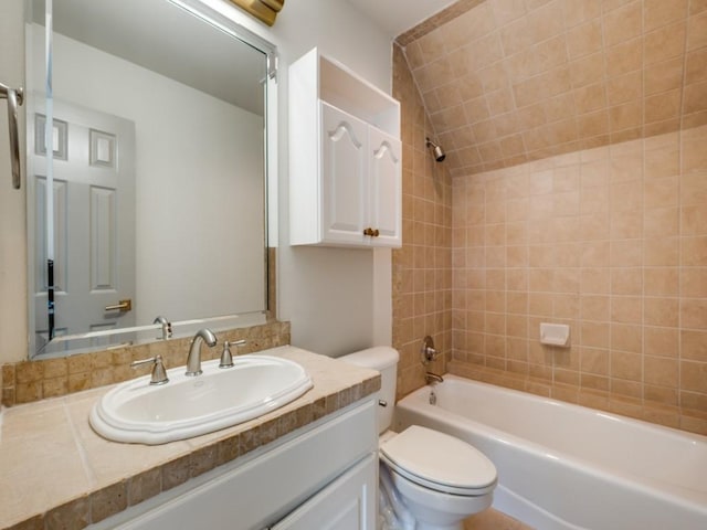 full bath with toilet, lofted ceiling, vanity, and  shower combination