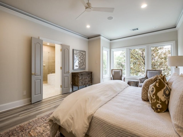bedroom featuring recessed lighting, wood finished floors, baseboards, visible vents, and crown molding