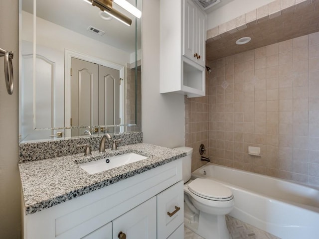full bathroom with toilet, visible vents, vanity, and shower / bathing tub combination