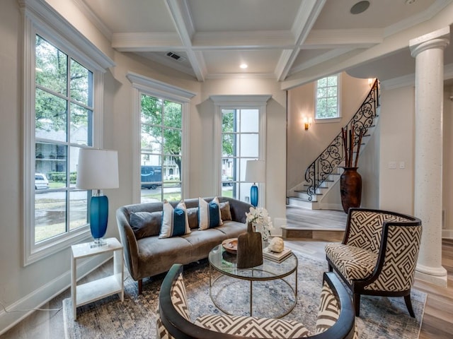 living area with beamed ceiling, stairway, coffered ceiling, visible vents, and wood finished floors