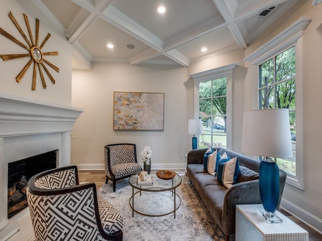 living room featuring coffered ceiling and baseboards