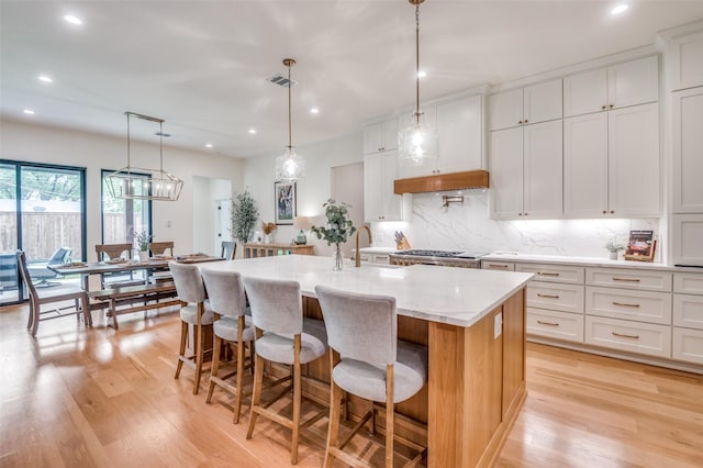 kitchen with recessed lighting, visible vents, and light wood-style floors
