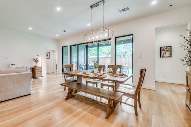 dining space with visible vents, light wood-type flooring, and recessed lighting
