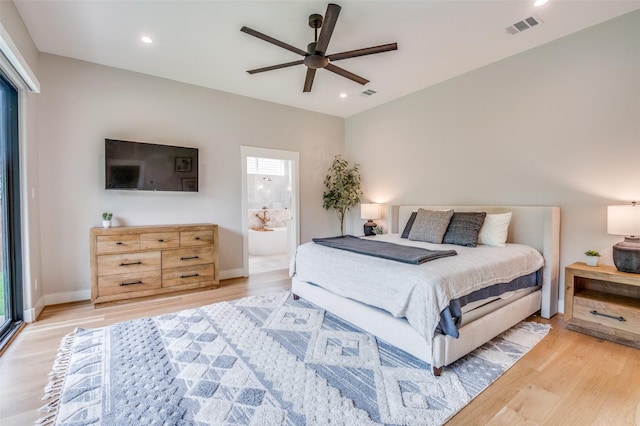 bedroom with visible vents, multiple windows, and light wood finished floors