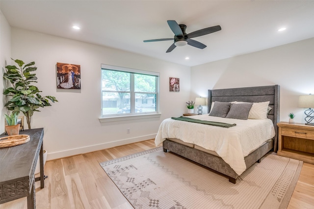 bedroom featuring baseboards, light wood-type flooring, ceiling fan, and recessed lighting