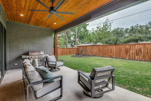 view of patio featuring a grill, ceiling fan, an outdoor living space, and a fenced backyard