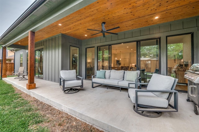 view of patio featuring fence, an outdoor hangout area, and a ceiling fan