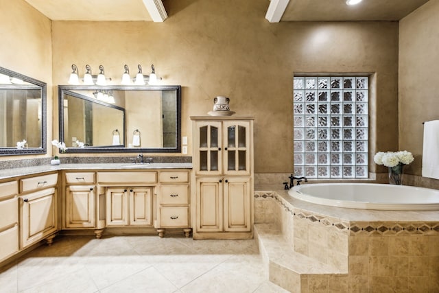 1233 Deer Lake Dr, Frisco, TX 75036 - bathroom featuring a garden tub, tile patterned flooring, and vanity