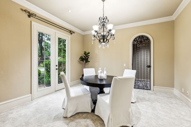 1233 Deer Lake Dr, Frisco, TX 75036 - dining space with light colored carpet, ornamental molding, baseboards, arched walkways, and a notable chandelier