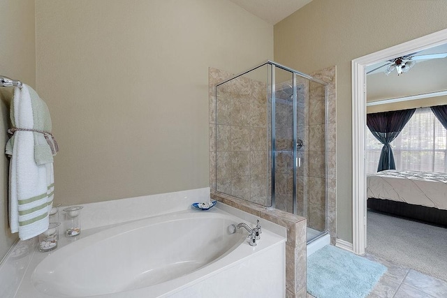 full bathroom with ensuite bath, tile patterned flooring, a stall shower, a ceiling fan, and a garden tub