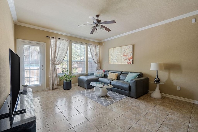 living area featuring baseboards, a ceiling fan, light tile patterned flooring, and crown molding