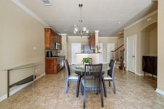 dining area with stairway, a chandelier, crown molding, visible vents, and baseboards