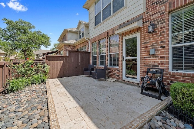 view of patio featuring fence