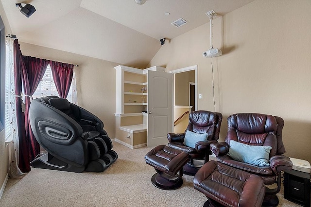 living area with an upstairs landing, visible vents, vaulted ceiling, carpet, and baseboards