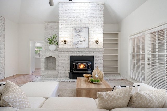 4703 El Brevo Ct, Arlington, TX 76017 - tiled living room featuring a ceiling fan, high vaulted ceiling, baseboards, and a fireplace
