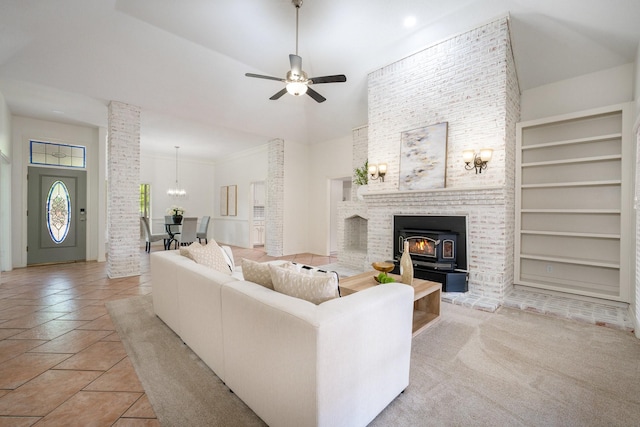 4703 El Brevo Ct, Arlington, TX 76017 - living room featuring a high ceiling, built in features, ornate columns, and ceiling fan with notable chandelier
