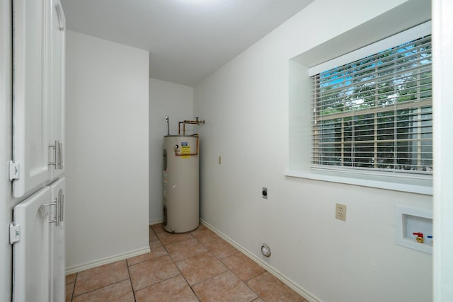 4703 El Brevo Ct, Arlington, TX 76017 - clothes washing area featuring laundry area, electric water heater, electric dryer hookup, washer hookup, and baseboards